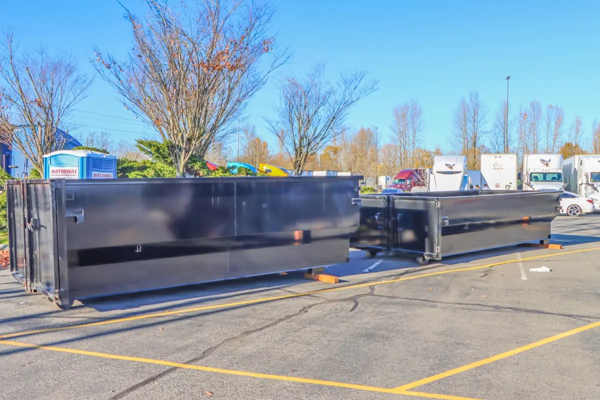 Professional dumpster rental service with roll-off container on residential driveway in Suwanee